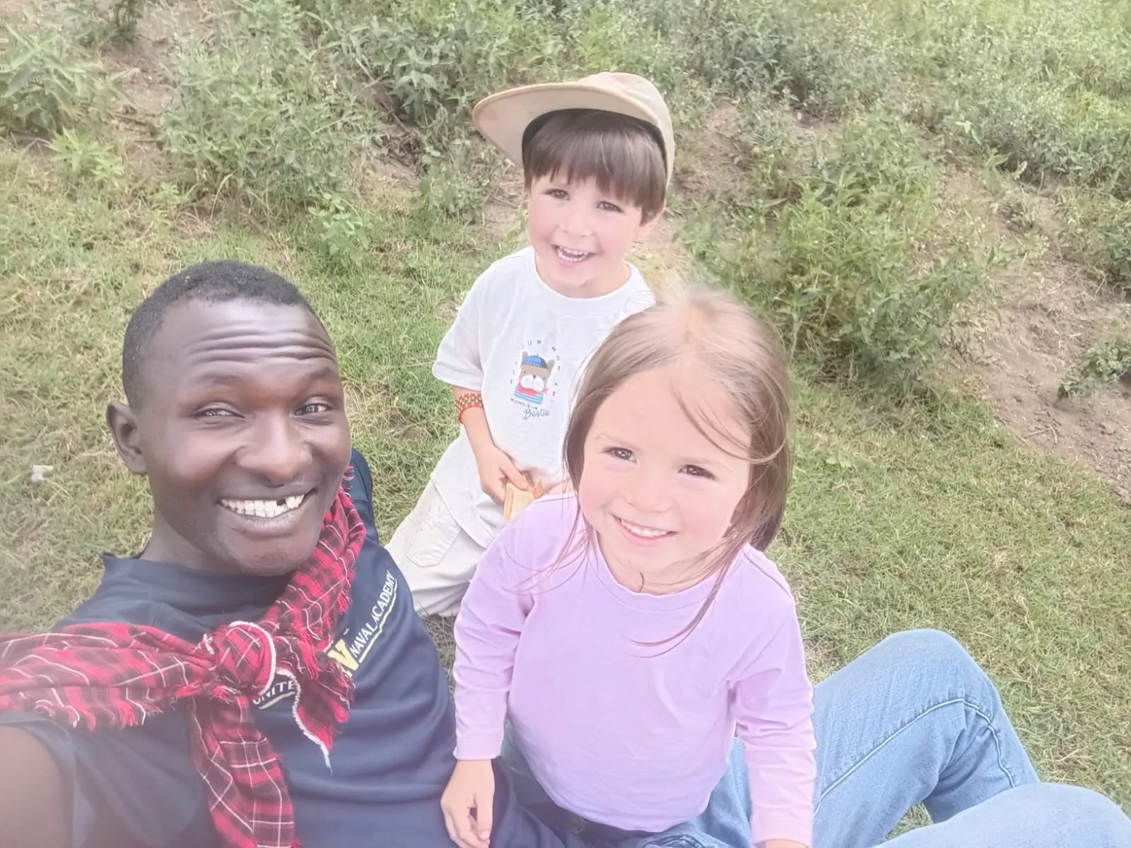 Timothy taking a selfie with two young guests